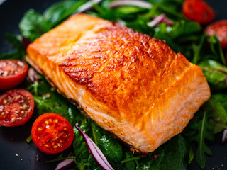 Fried salmon steak with vegetables 