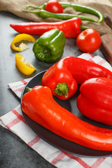 Red chili peppers in a black saucer