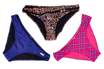 Swimsuits isolated. Collage set of three various elegant female sexy multcolored bikini bottoms or...