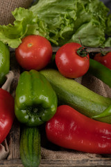 Green and red vegetables with tomatoes and cucumbers.