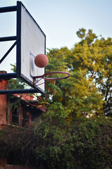 Uttar Pradesh/India - February 26, 2020: basketball hoop and net on background of blue sky