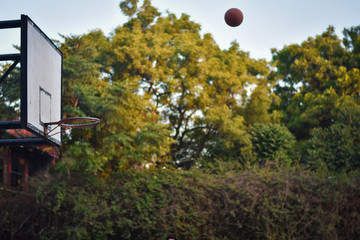 Uttar Pradesh/India - February 26, 2020: basketball hoop and net on background of blue sky