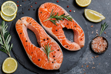 Salmon. Raw trout red fish steak with ingredients for cooking. Cooking Salmon, sea food. Healthy eating concept