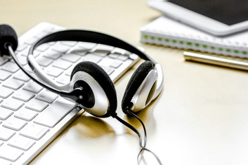 headset and keyboard on workdesk for call center concept