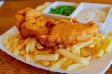 Close up shot of a plate of traditional fish and chips
