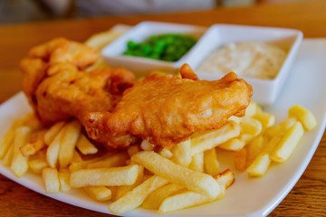 Close up shot of a plate of traditional fish and chips