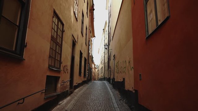 Apartment building streets in Stockholm area at winter. Scandinavian facades of old town houses in the narrow streets. Traveling concept. Slow motion. Steadicam shot