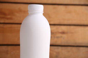 liquid yogurt bottle in color background