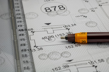 pen and ruler on an architectural plan