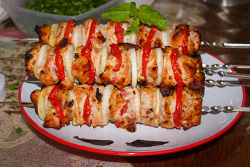 Shish kebab with vegetables and spices on skewers