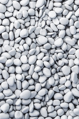 texture of white painted pebbles