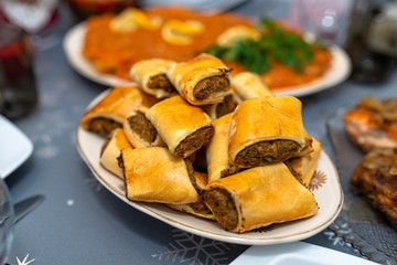 Baked pate in a pie lying on a holiday table on a plate.