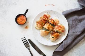 Chicken rolls in a bacon filling with spinach