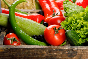 Chilies, zucchini, tomato and lettuce.