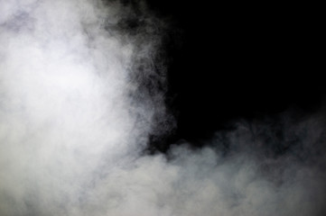 White steam on a dark background.