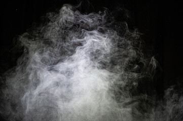 White steam on a dark background.