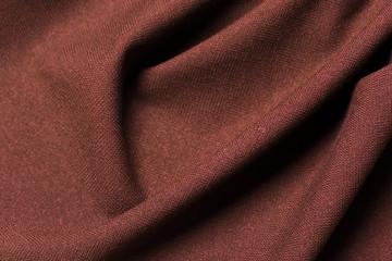 Rough brown woolen cloth fabric texture. abstract background with soft waves. Wavy lines