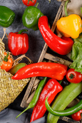 Colorful chili peppers on a blue table.