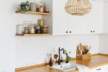 U-shape modern white kitchen scandinavian style. Kitchen interior ideas. Eco friendly kitchen, zero...
