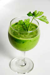 Green detox juice. Healthy smoothie from baby spinach, avocado, kiwi and parsley. Healthy eating concept.