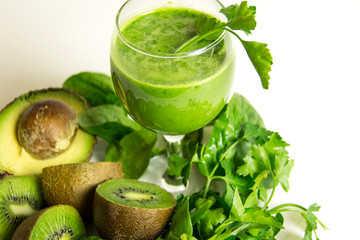 Green detox juice. Healthy smoothie from baby spinach, avocado, kiwi and parsley. Healthy eating concept.