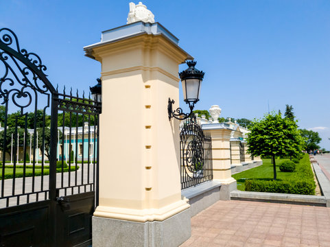 CLoseup image of vintage forged light lamp on the gates at royal palace