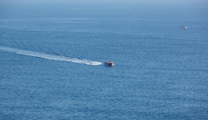 Obraz premium pleasure boat on the waves of the Mediterranean Sea