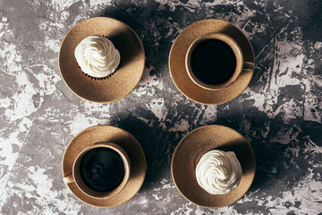 Obraz na płótnie Canvas Cupcakes with cups of coffee.