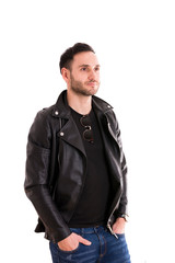 Fototapeta premium portrait of a serious young man with black jacket, handsome guy, rock style..