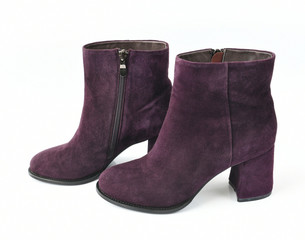 The wine-colored women boots on white background