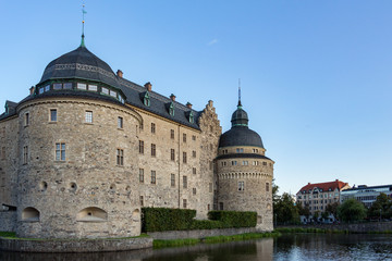 Fototapeta na wymiar Örebro Castle is a medieval castle fortification in Örebro, Sweden. It lies on an island in river Svartån and it’s one of the most famous castles in Sweden.