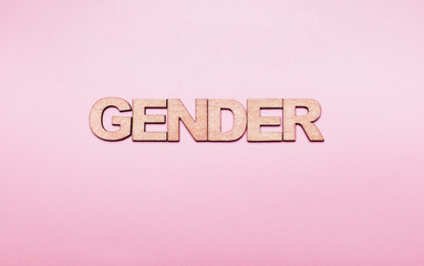 The word gender in  on a pink background