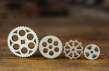 Fototapeta premium wooden gears on a wooden background