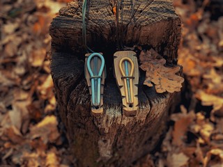 Two pagan Jew's harps on the stump of an old tree. Jew's harp and shamanism. Calling Spirits....