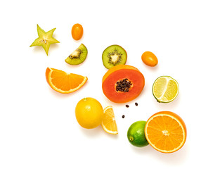 Fruits healthy food layout. Papaya, orange, kiwi, lemon isolated on white. Detox fruity health vitamin diet creative concept. Colorful fresh raw fruit tropical vegan background, top view.