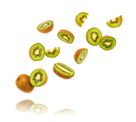 Fresh kiwi fruit flying in air isolated on white. Healthy fruity green color diet food. Sweet summer whole, cut kiwi background. Colorful levitation, falling fly kiwi fruit creative concept