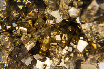 Macro of Pyrite mineral with golden cubic patterns