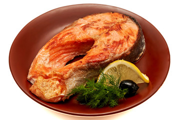 Fried trout with lemon, olives and herbs