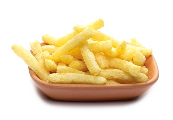 Flips, chips snacks in clay bowl, pot isolated on white background