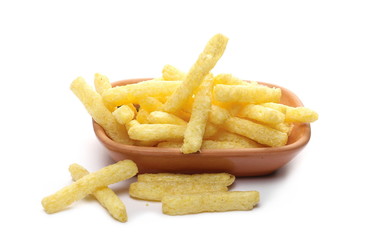 Flips, chips snacks in clay bowl, pot isolated on white background