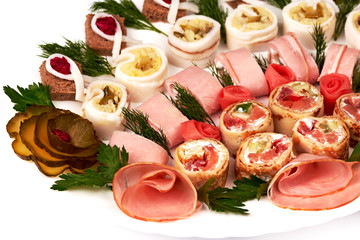rolls of bacon, ham, garlic, pickles, horseradish and rye bread