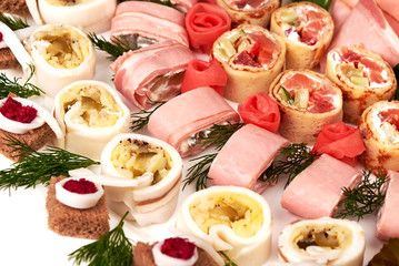 rolls of bacon, ham, garlic, pickles, horseradish and rye bread