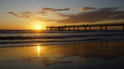 reflections in the sunset on the beach