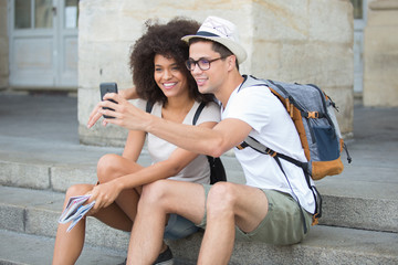 young couple on holidays taking selfie
