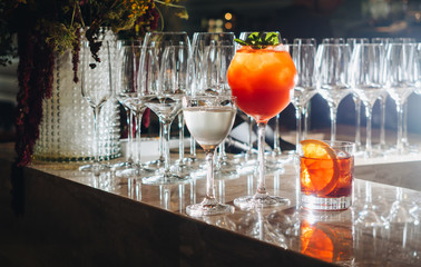 Cocktails on bar counter in night club bar