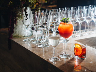 Cocktails on bar counter in night club bar