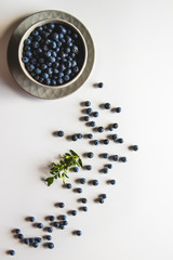 Fototapeta na wymiar Blueberries in bowl isolated on white background. Healthy food, health