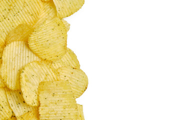 Chips with spices lie on a white background with copy space.