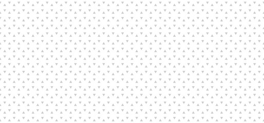 Light gray abstract background with triangles. Seamless vector pattern.