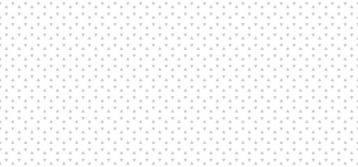 Light gray abstract background with triangles. Seamless vector pattern.